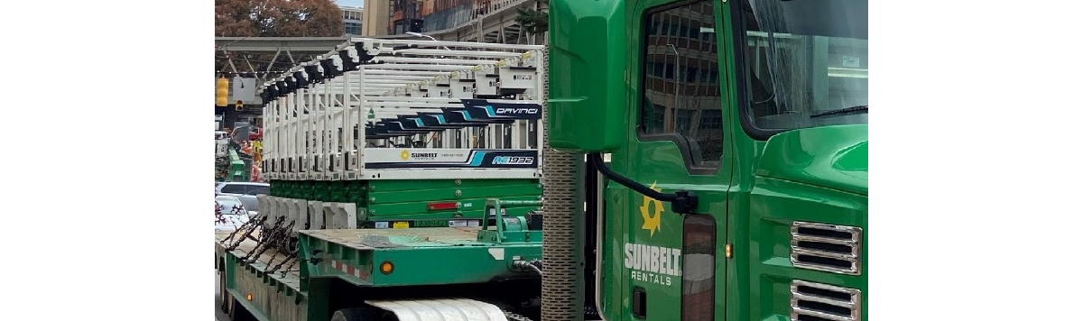 All-electric scissor lift on a truck's trailer