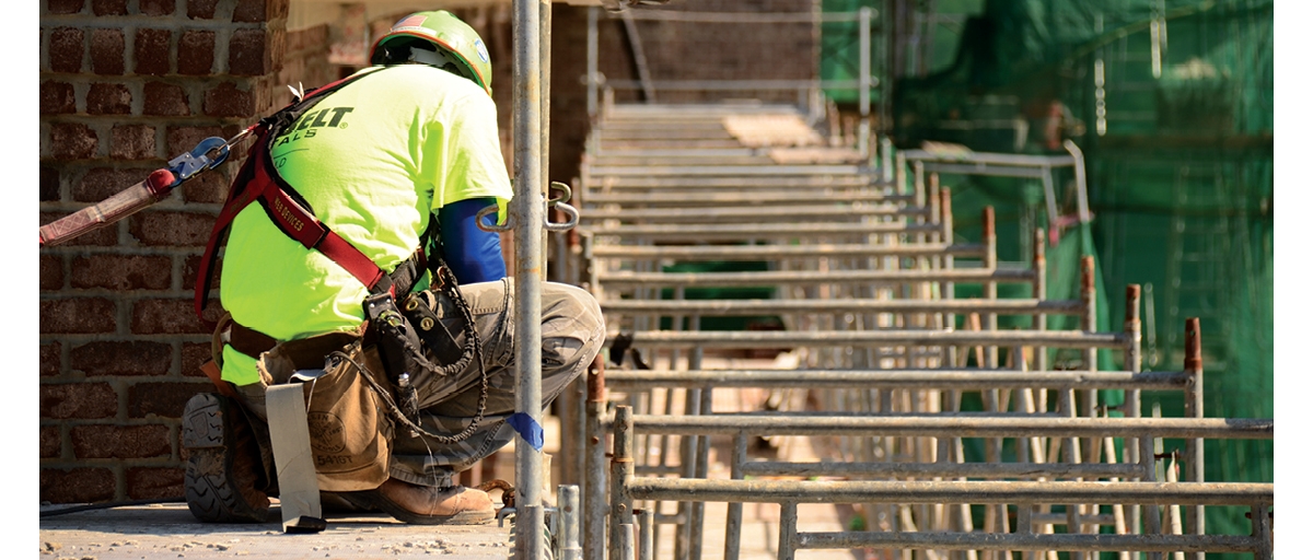 Construction worker on scaffolding.