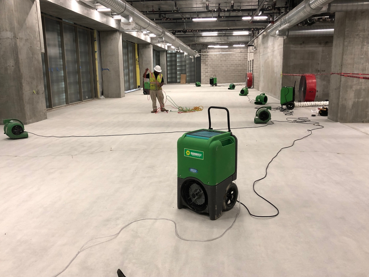 Dehumidifiers distributed throughout a warehouse space.