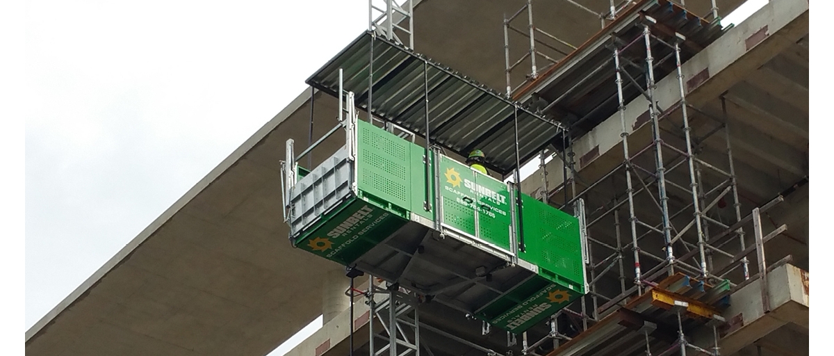 Sunbelt Rentals scaffold services worker working at height safely.