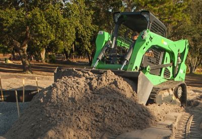 Sunbelt Retnals Skidsteer moving dirt