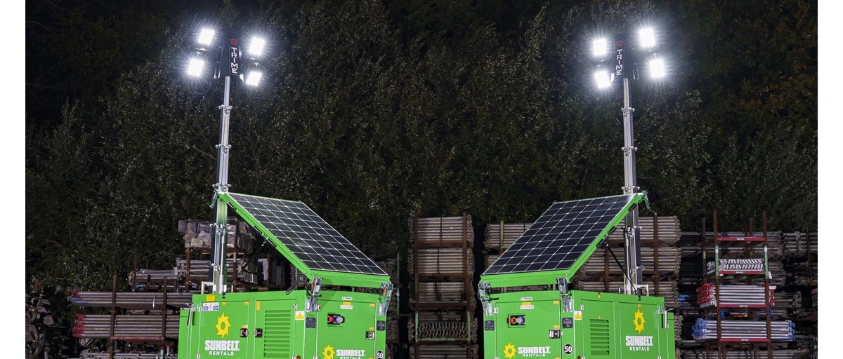 Two solar powered lights from Sunbelt Rentals brighten a rainy work site.