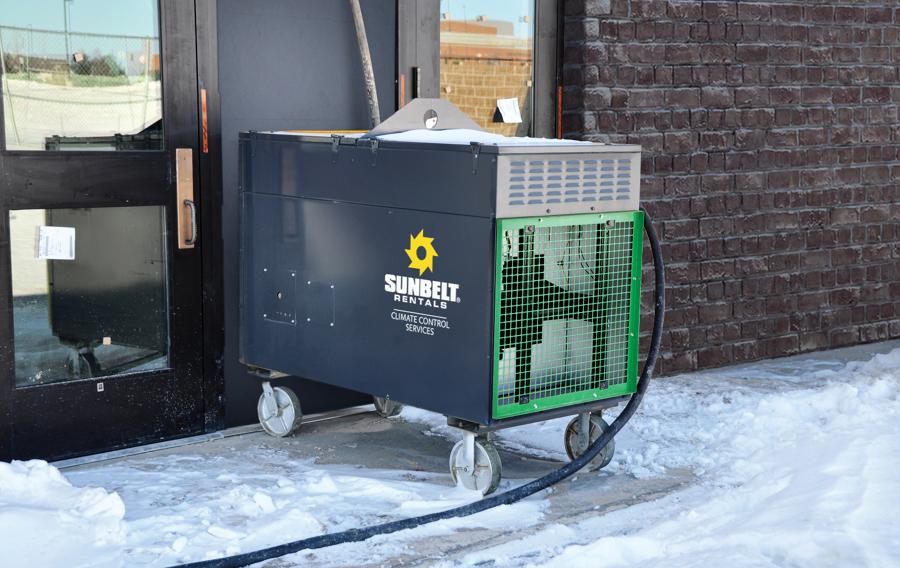 A direct-fired heater from Sunbelt Rentals installed at a school building.