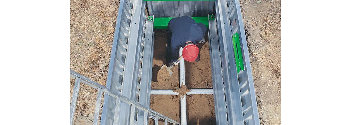Hardhat worker in a trench