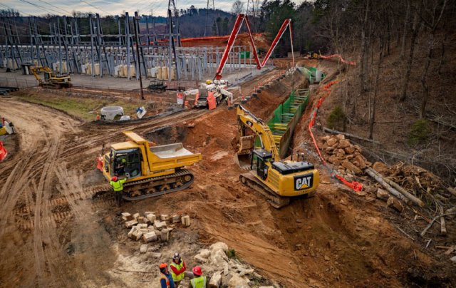 A construction site with a series of trench boxes installed.