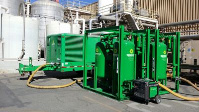 Air compressors from Sunbelt Rentals outside.