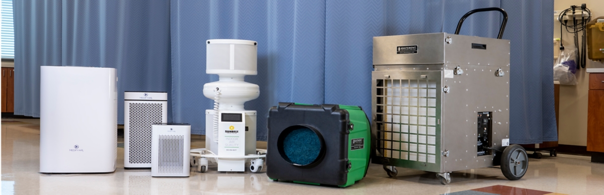 A lineup of air scrubbers in a hospital setting.