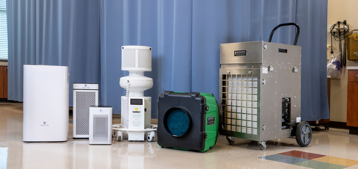 A lineup of air scrubbers in a hospital setting.