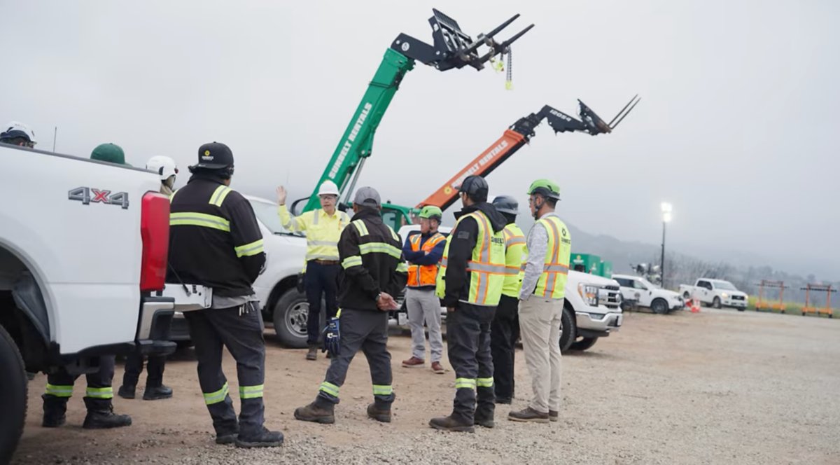 Workers wearing safety apparel at an emergency response job site.