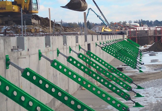 A wall and trench system supporting the land surrounding it.