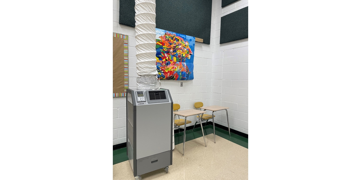 A portable heat pump installed in a classroom.