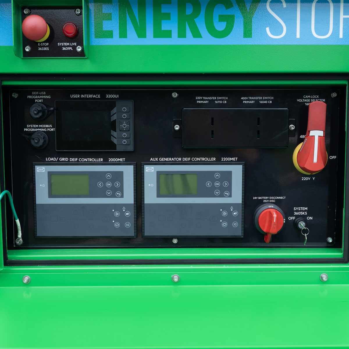 Close-up of an energy storage system control panel featuring multiple switches, dials, and digital displays. 