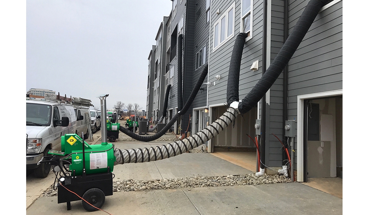 Heating equipment from Sunbelt Rentals, installed outside of residential buildings.