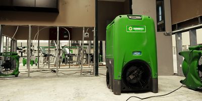 A refrigerant dehumidifier from Sunbelt Rentals, in an athletic building.