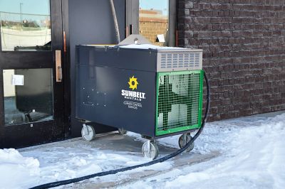 A direct-fired heater installed near snow.