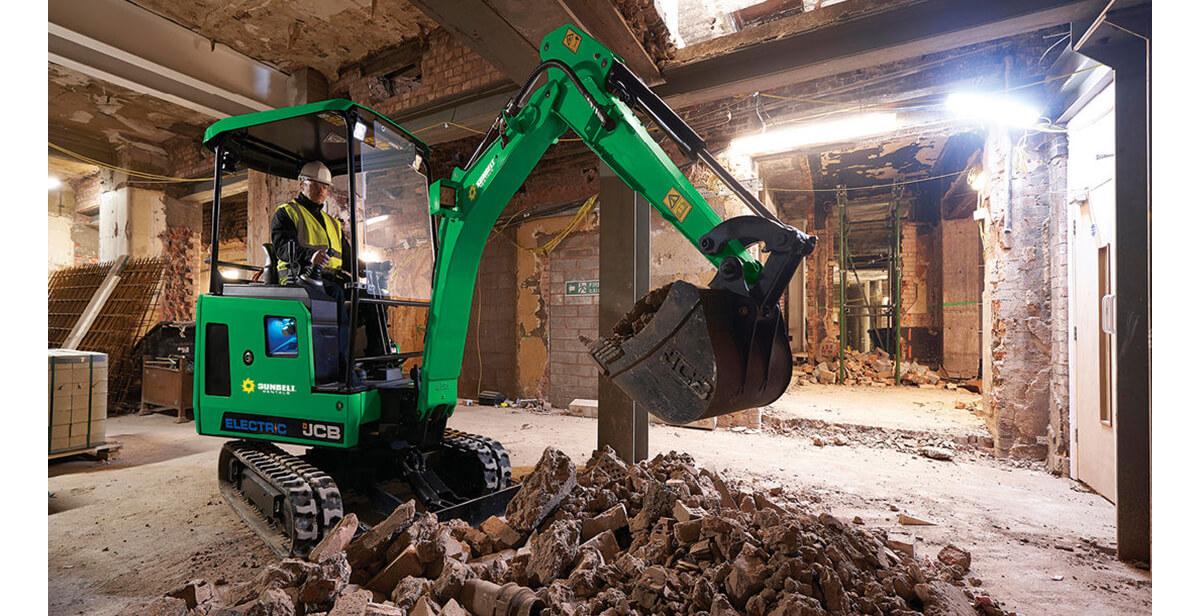 An excavator in a building under construction.