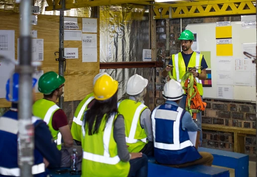 People wearing safety apparel taking a safety training course.