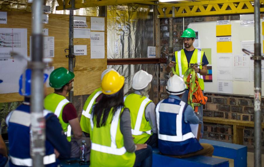 People wearing safety apparel taking a safety training course.