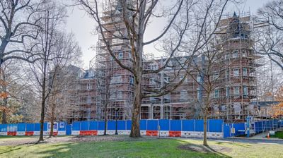 Frame and brace scaffolding against a building.