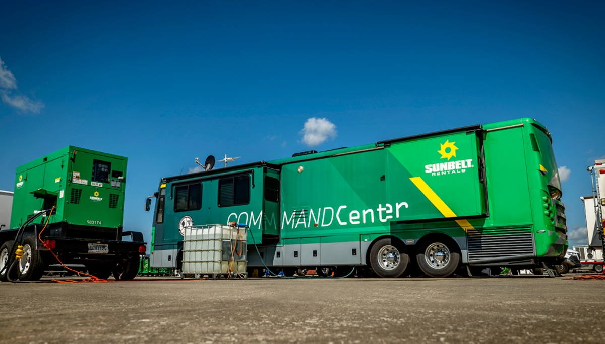 A Sunbelt Rentals Command Center bus alongside a portable generator.