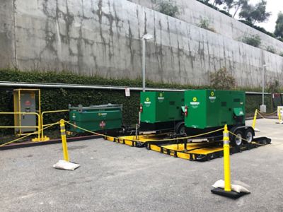 Generators from Sunbelt Rentals outside of a building.