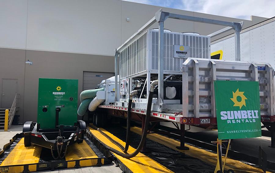 A commercial air conditioning rental unit installed outside of a building.