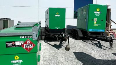 A hybrid energy system outside of a building, using a battery energy storage system and generators.