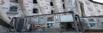 Dehumidifiers from Sunbelt Rentals installed at a construction site.