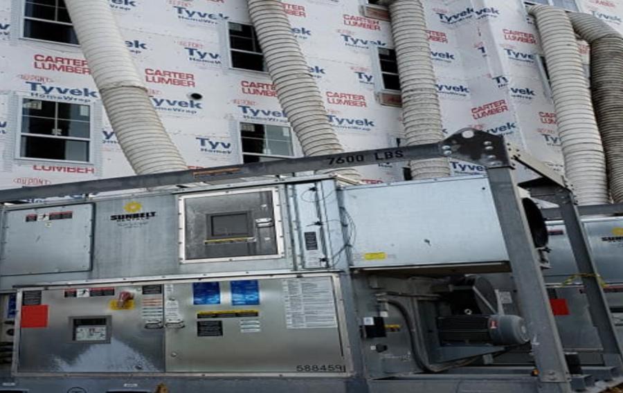 Dessicant dehumidifiers in front of a building that is in construction.