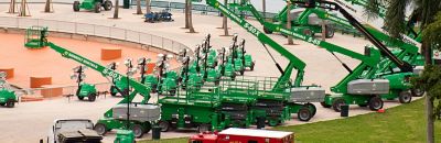 Manlifts and light towers at an event site.