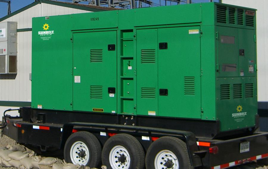 A generator from Sunbelt Rentals outside of buildings.