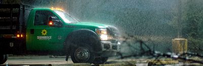 A truck driving through a storm.