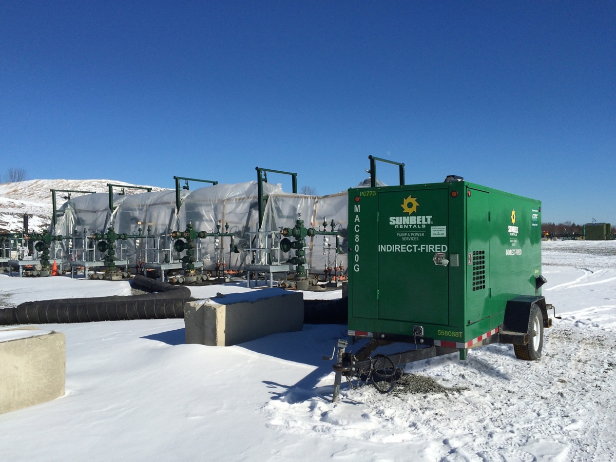 An indirect-fired heater from Sunbelt Rentals installed outside during the winter.