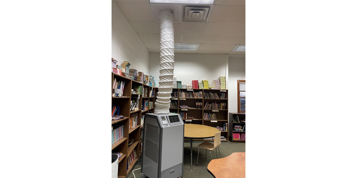 A portable heating pump installed in a school library.