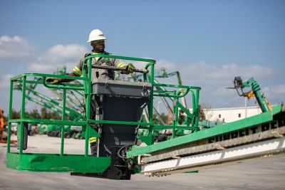 A close-up view of someone operating a manlift.