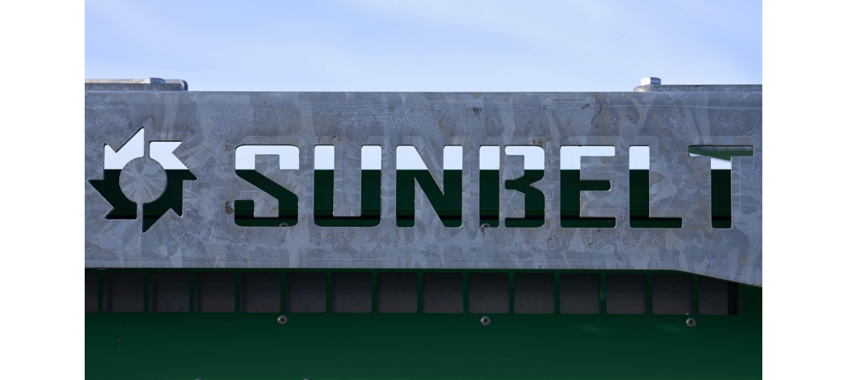 A metal Sunbelt Rentals sign.