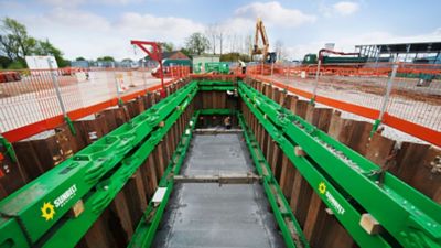 Trench bracing and boxing in a trench with caution fencing