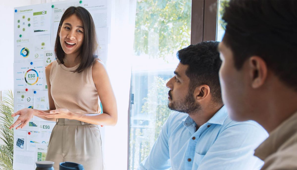Three people in a meeting.