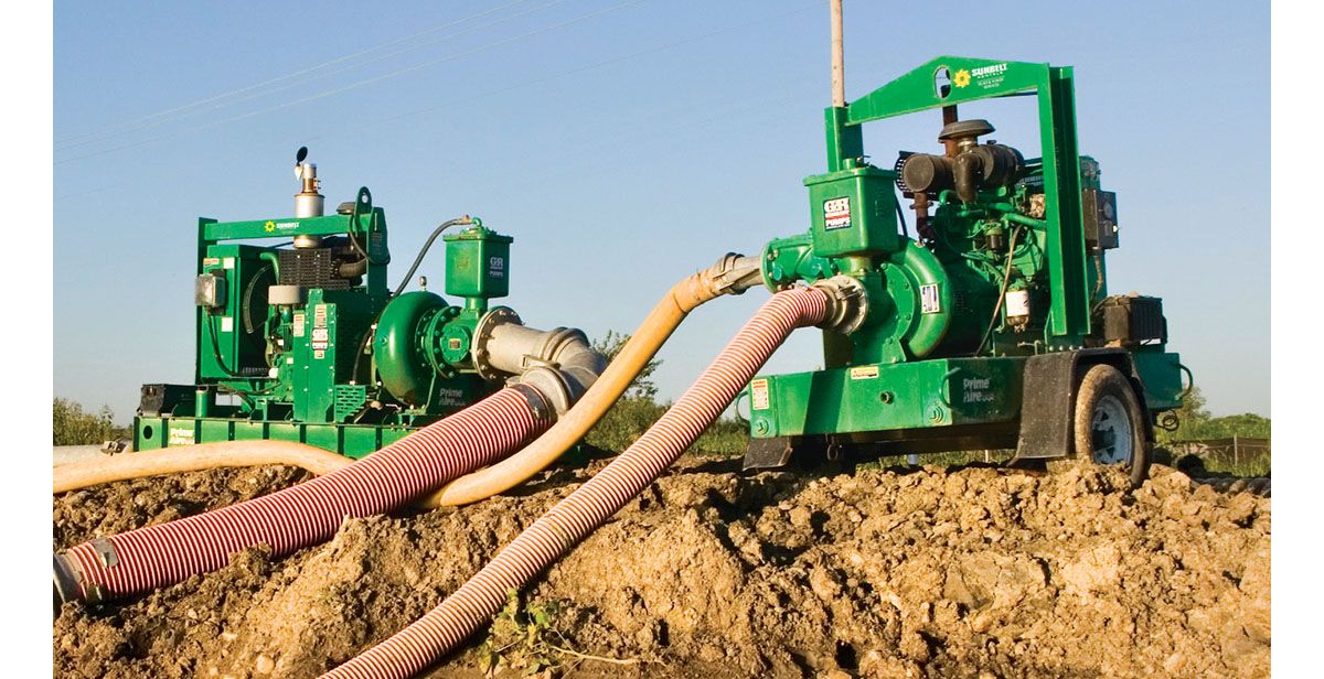 Two high head pumps from Sunbelt Rentals installed at a dirt construction site. 