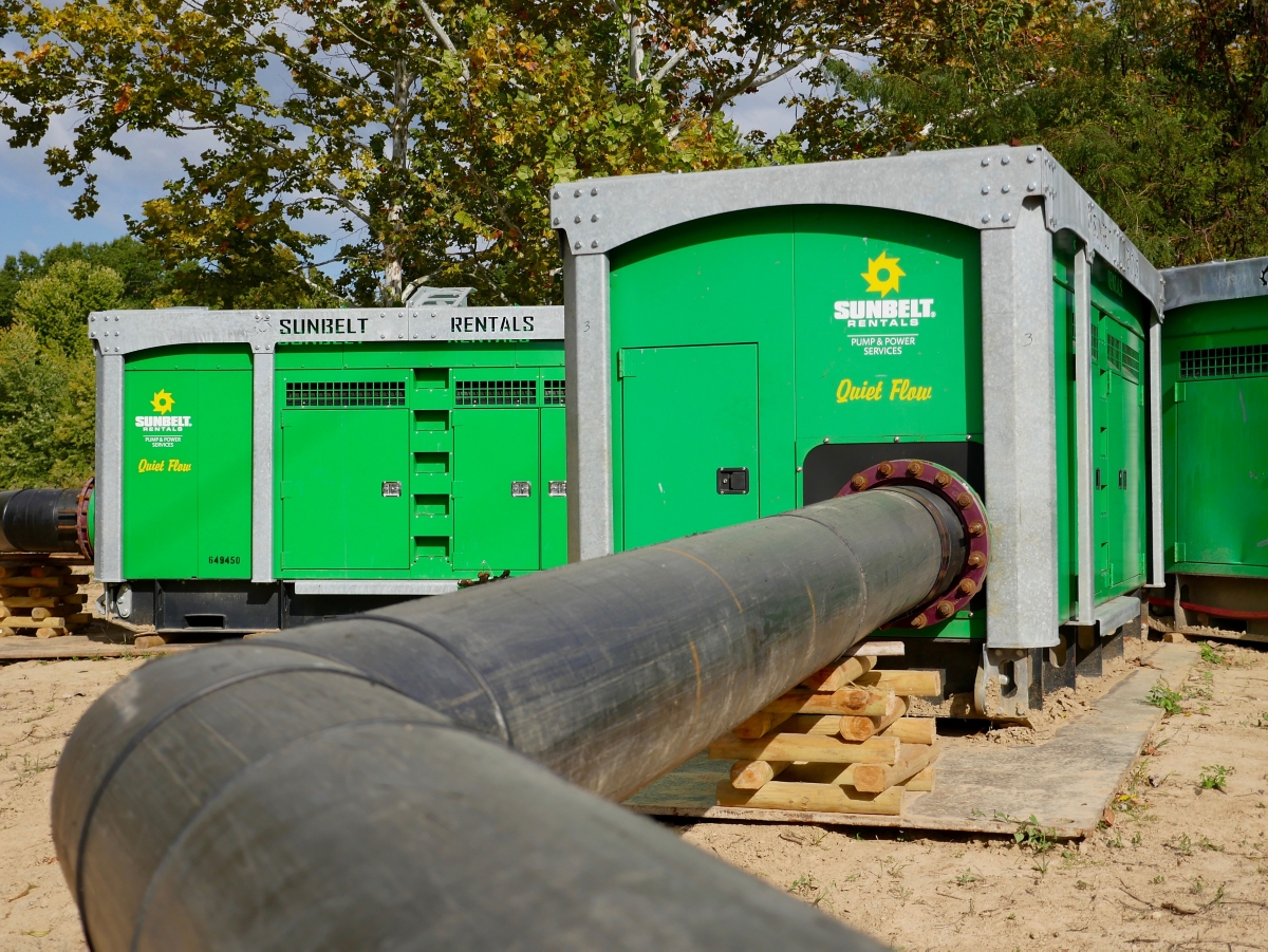 Quiet flow diesel trash pumps from Sunbelt Rentals at a job site.