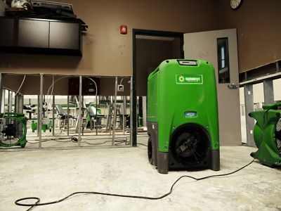 A refrigerant dehumidifier from Sunbelt Rentals, in an athletic building.