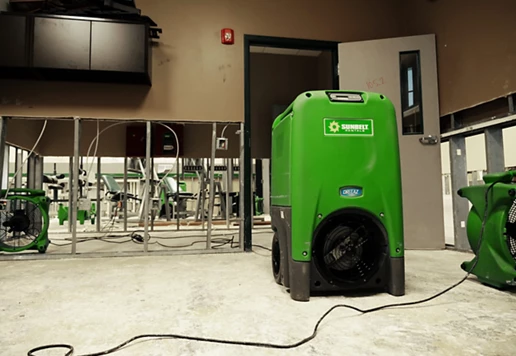 A refrigerant dehumidifier from Sunbelt Rentals, in an athletic building.