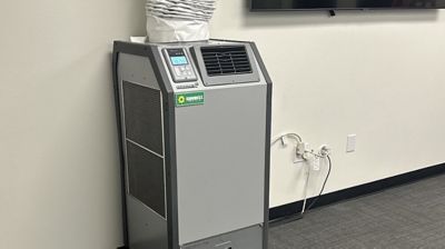  A spot cooler rental from Sunbelt Rentals installed inside of a building.