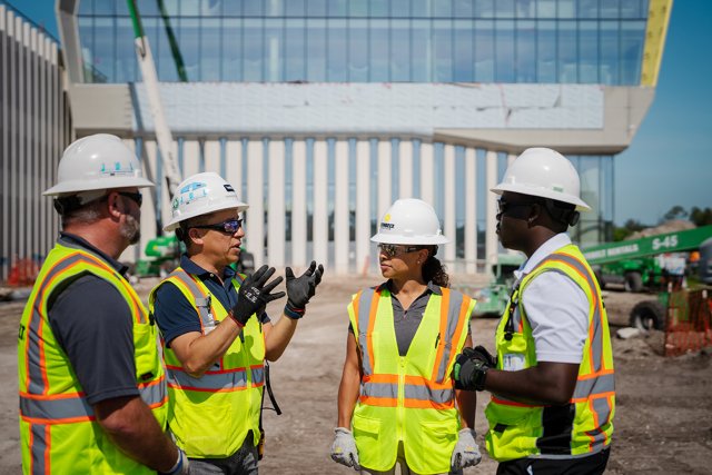 Sunbelt Rentals workers talking on a jobsite. 
