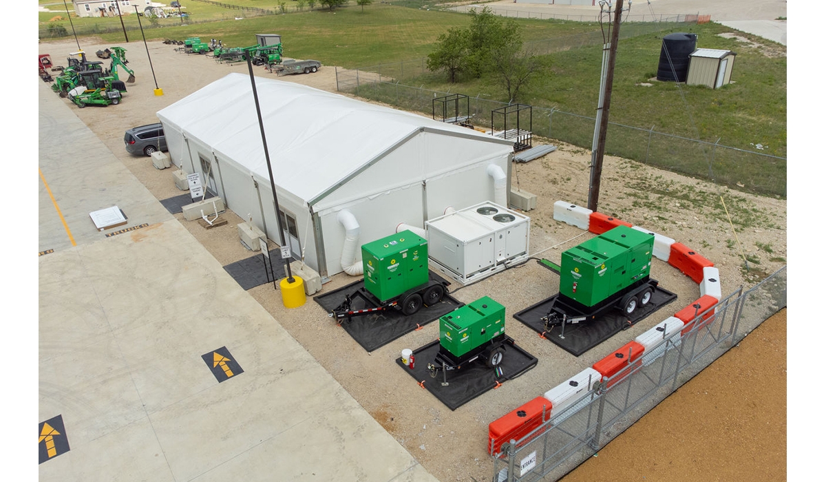 A fabric structure with Sunbelt Rentals equipment around it.