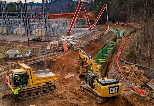 A construction site with a series of trench boxes installed.