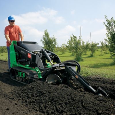 Someone digging with a trencher.