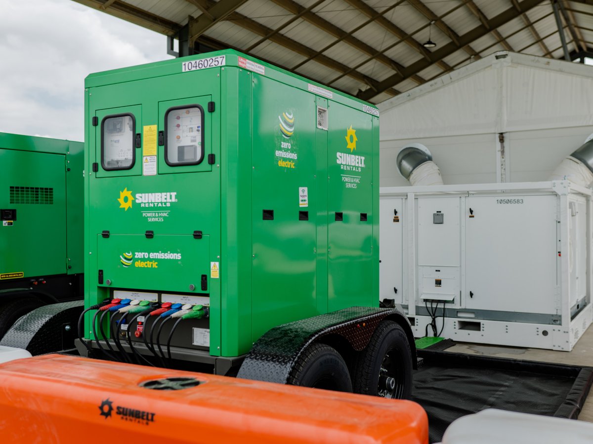 A Sunbelt Rentals BESS electric generator under an open shelter.