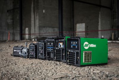 A row of industrial welding power units.