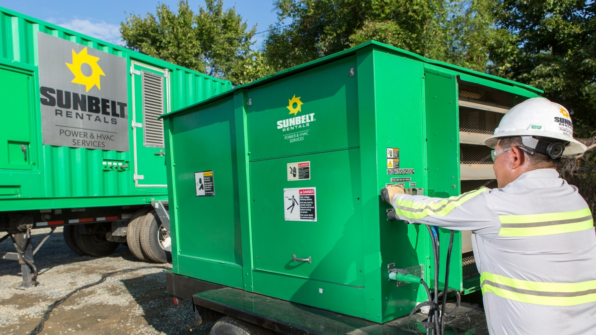 Sunbelt worker operating power and HVAC service equipment.